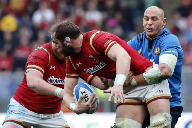 Wales" Alun Wyn Jones (C) in action against Italy"s Sergio Parisse