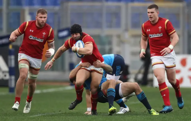 Leigh Halfpenny of Wales is tackled by Luke McLean of Italy