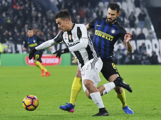 Juventus" Paulo Dybala in action against Inter Milan"s Antonio Candreva