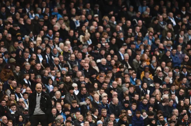 Pep Guardiola watches on