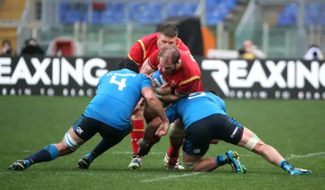 Wales" Alun Wyn Jones in action with Italy"s Marco Fuser and George Biagi