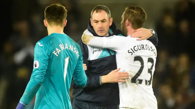 Paul Clement hugs Glyfi Sigurdsson