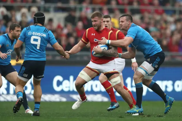 Ross Moriarty of Wales is surrounded by Italian tacklers