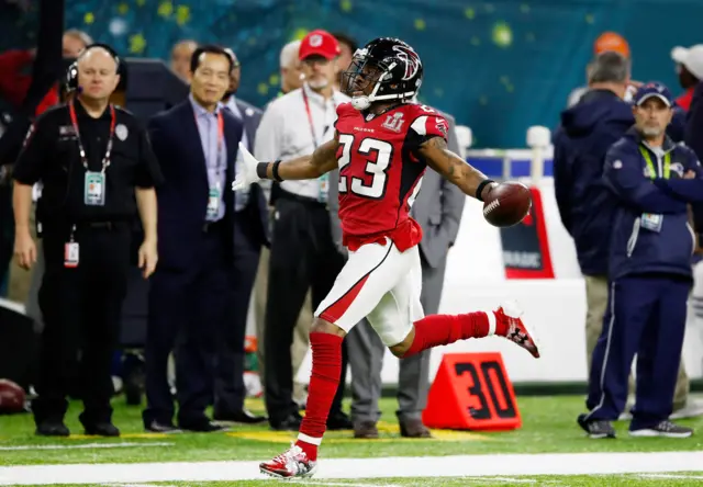 Robert Alford celebrates