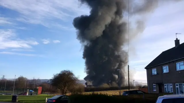 Huge plume of smoke from fire