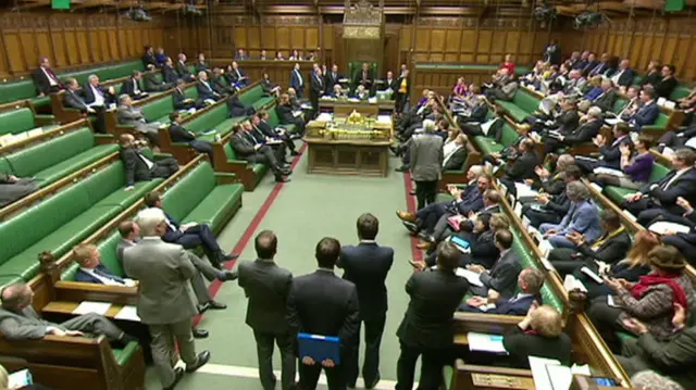 MPs applauding