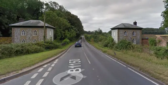 A house either side of the B1150 at Westwick