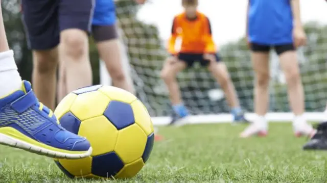 Kids playing football