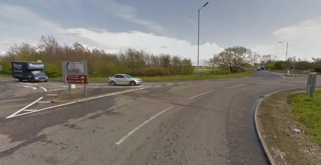 The roundabout at Acle, with the A1064 to the left and A47 ahead