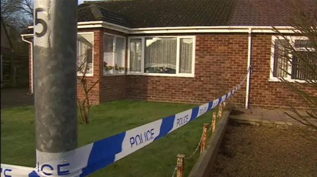 Police tape sealing off bungalow