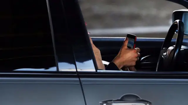 Person on phone while driving