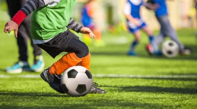 Child playing football