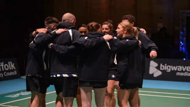 Suffolk Saxons team huddle