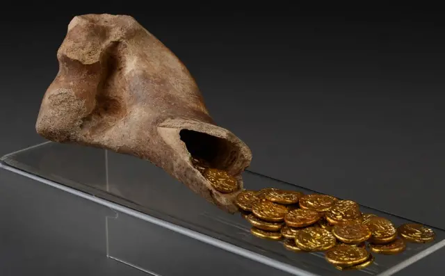 The cow's horn and gold coins