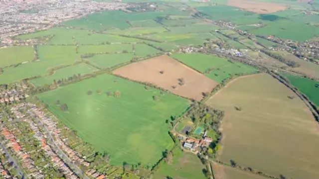 Aerial view of the site from South East