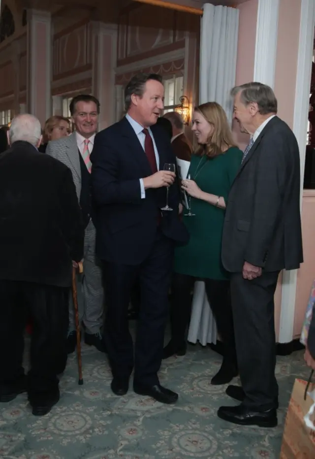 David Cameron speaking to Lord Dubs at the Oldie of the Year awards