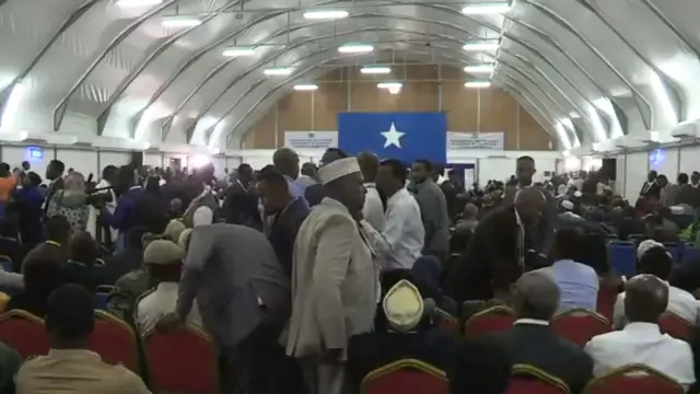 People in the aircraft hangar