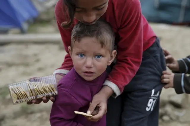 Children in a camp for refugees and migrants in Greece