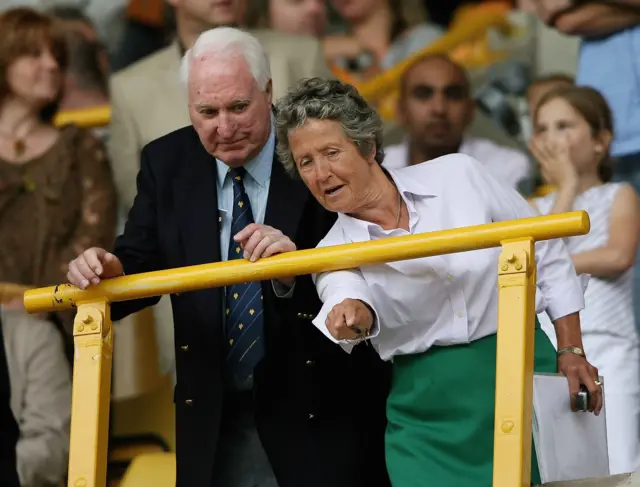 Wolves President Sir Jack Haywood (l) and director Rachael Heyhoe Flint watch the teams come out during a pre-season friendly match between Wolverhampton Wanderers and Aston Villa at Molineux on July 29, 2006