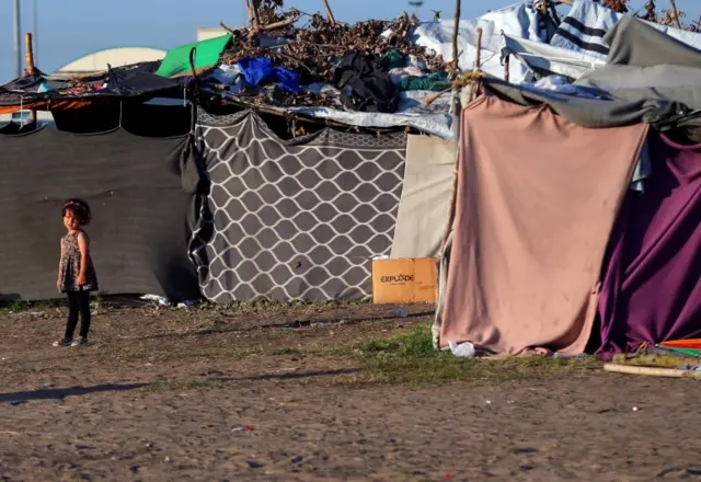 A child refugee in a transit zone on the Hungarian-Serbian border