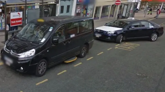 Taxis at a rank in Stoke-on-Trent