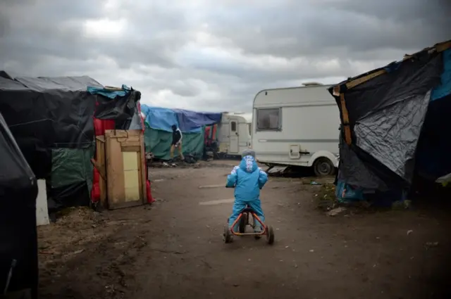 A child in the Jungle refugee camp in Calais, France