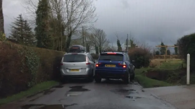 Two cars on Harvey Lane