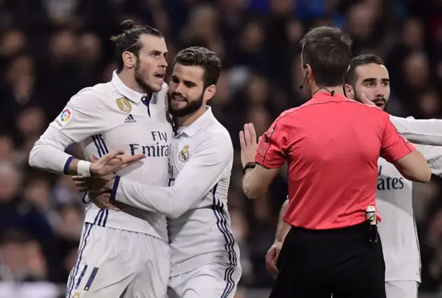 Bale argues with the referee