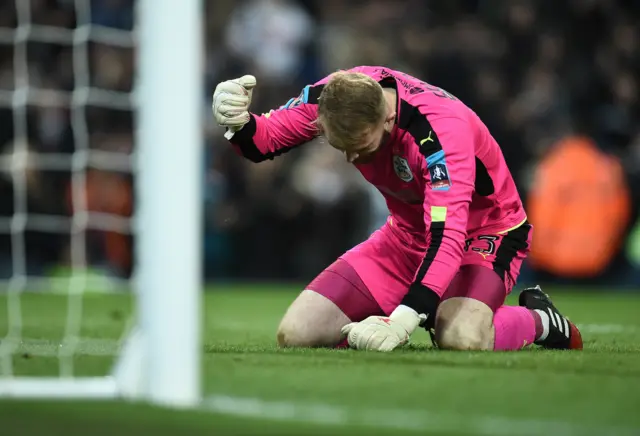 Huddersfield Town's English goalkeeper Joel Coleman reacts