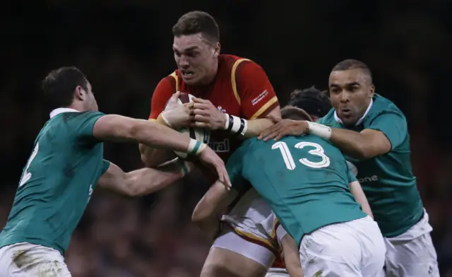 George North breaks through Irish tackles to score