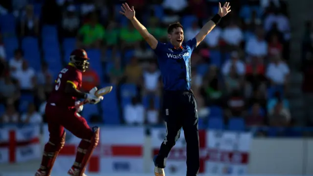 Chris Woakes celebrates in the first ODI