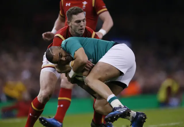 Simon Zebo is tackled by George North