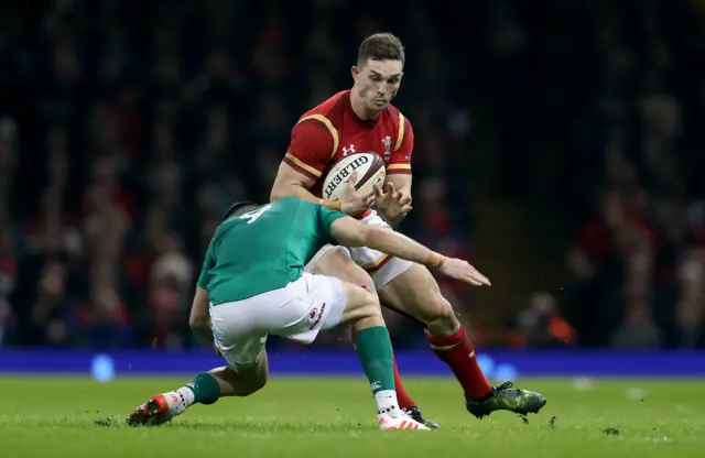 George North runs at Conor Murray