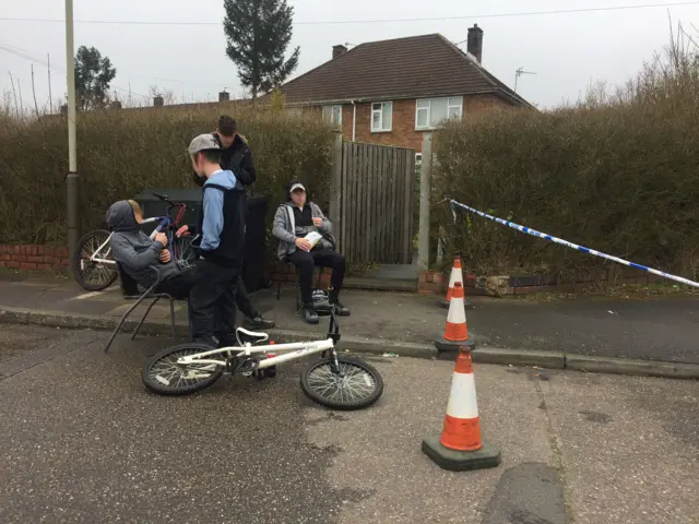 Onlookers at police cordon