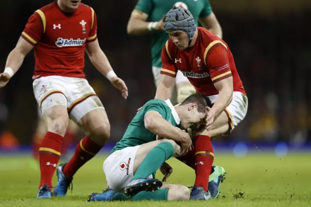 Jonny Sexton collides with Jonathan Davies