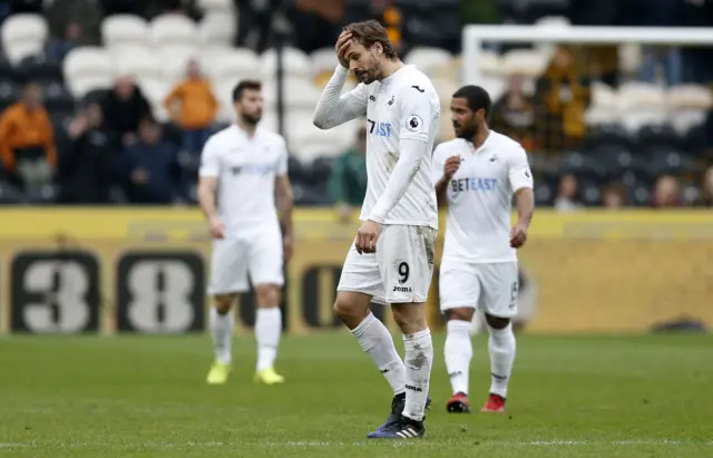 Llorente looks dejected as he is subbed off