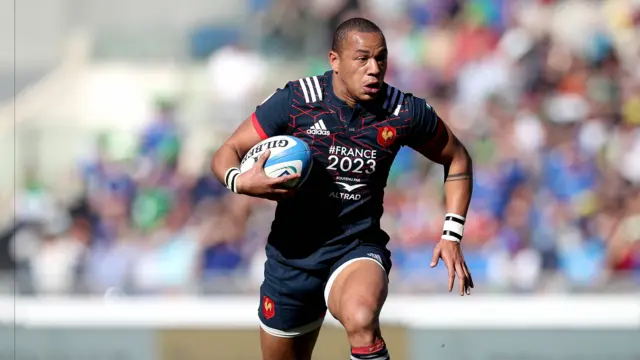 France's Gael Fikou scores a try