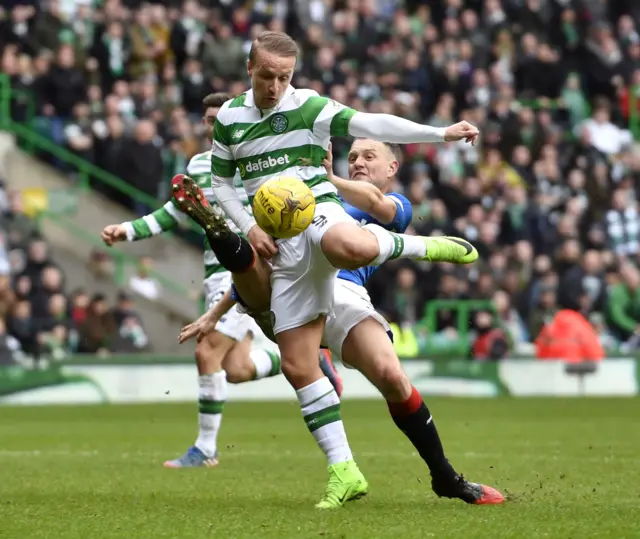 Clint Hill challenges Leigh Griffiths