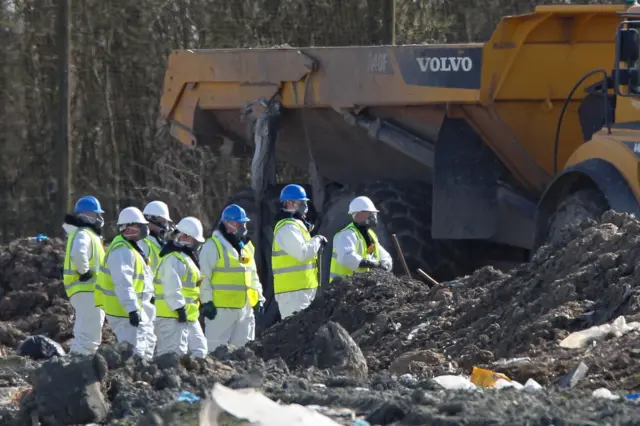 Search teams at landfill