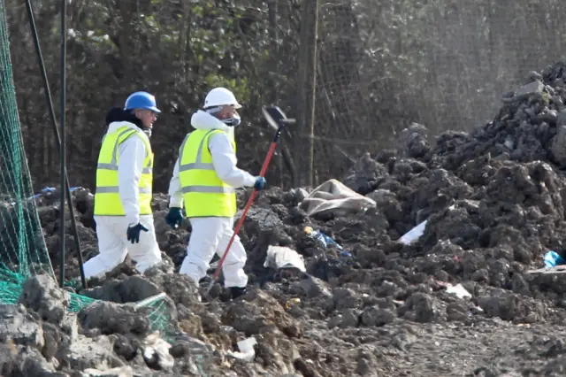 Search teams at landfill