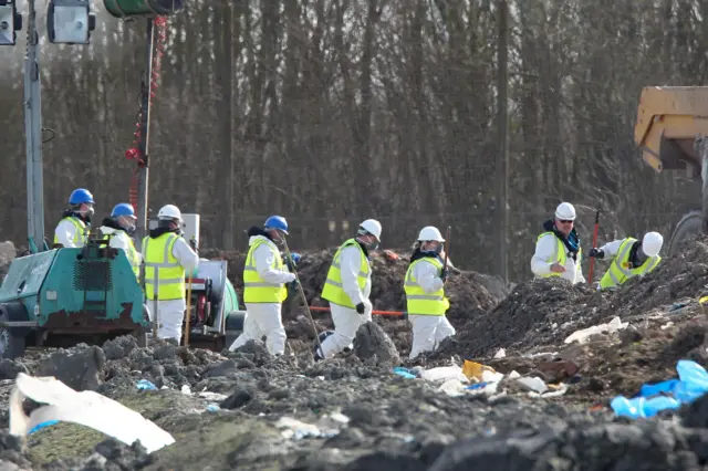 Search teams at landfill