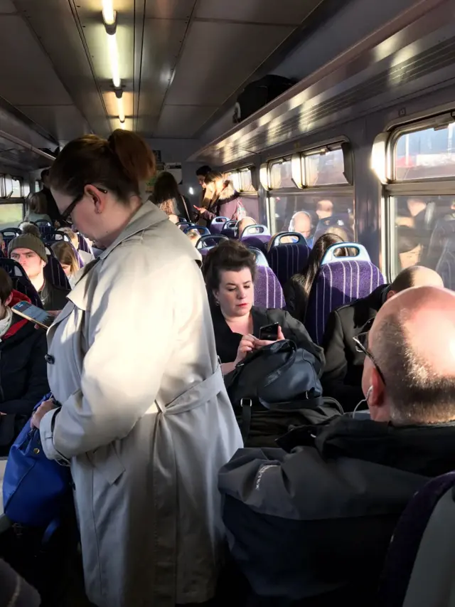 People standing on Northern train