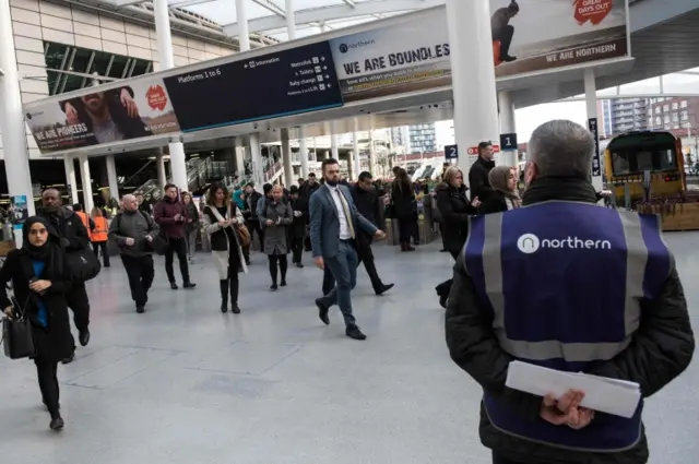 Passengers at Manchester's Victoria station