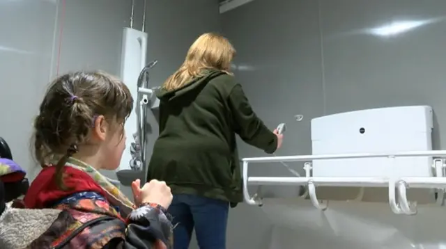 
          Lorna Fillingham and her daughter in a new disabled toilet at Brigg recreation ground
        