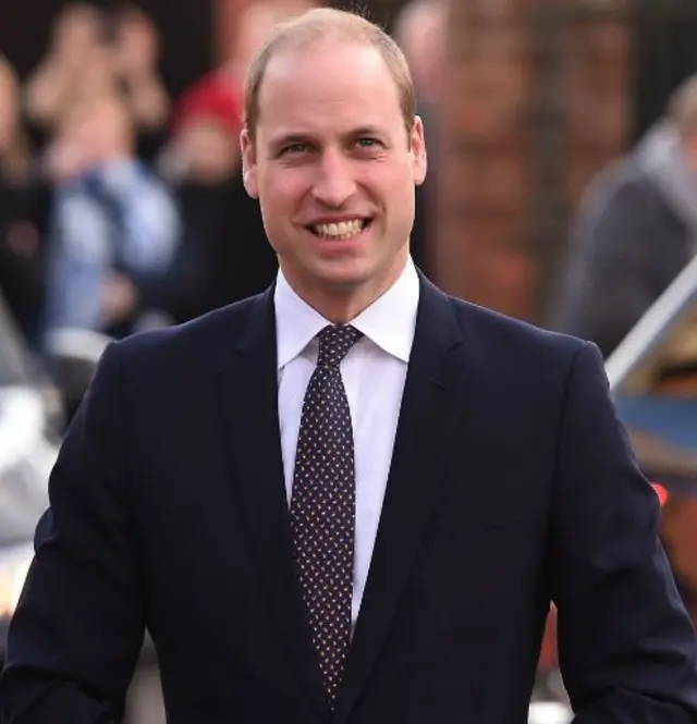 The Duke of Cambridge in dark suit and spotted tie