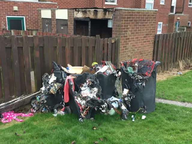 Fly tipping rubbish on housing estate