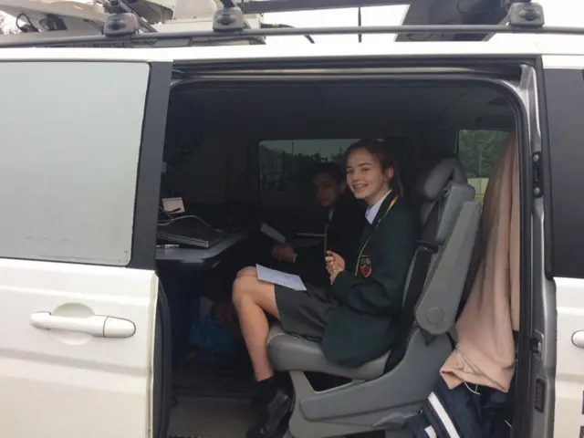 School pupils in a radio car