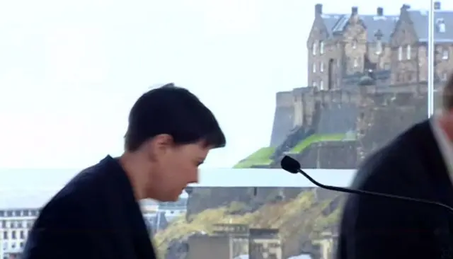 
          Ruth Davidson and David Mundell leave the Point Hotel in the shadow of the Edinburgh Castle
        