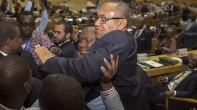 New Caf president Ahmad is held aloft