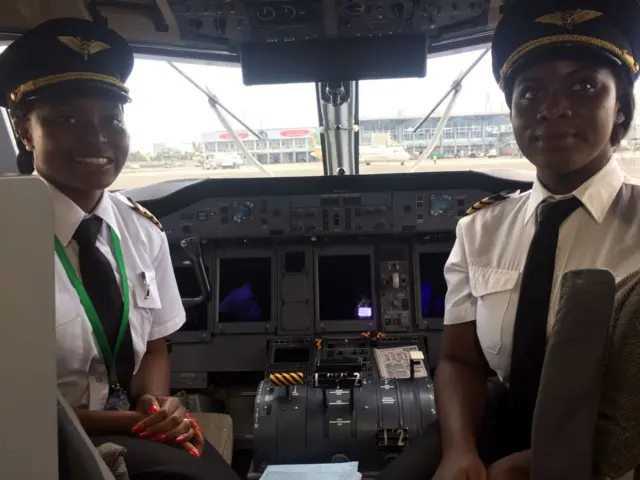 
          Malawian pilot Captain Yolanda Kaunda and her co-pilot in the cockpit
        